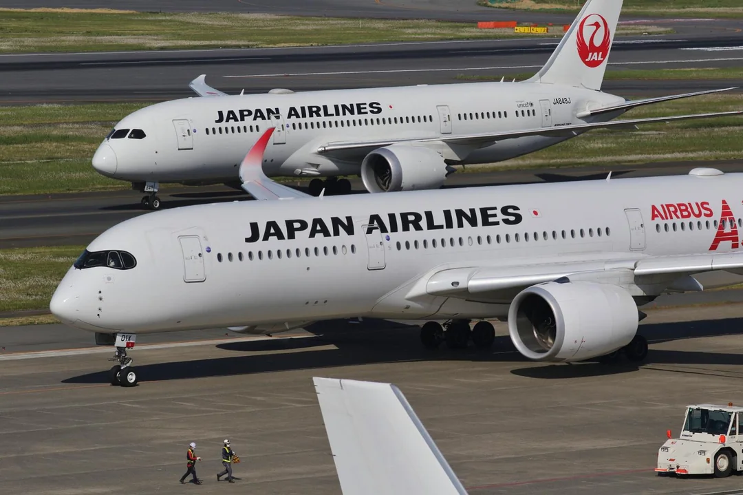 Japan Airlines Airbus A350 (foreground) and Boeing 787 (background) planes.